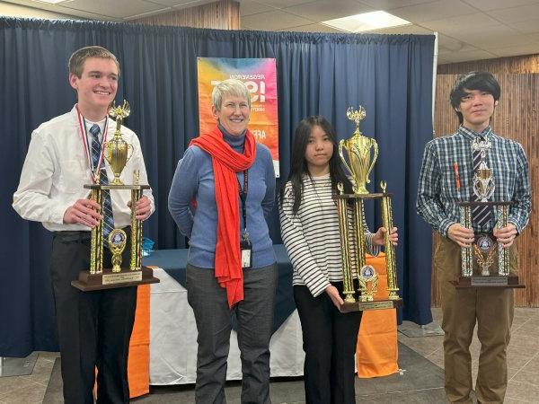 Provost Stephanie Nesbitt stands with winners of the 2024 Regional Science Fair.